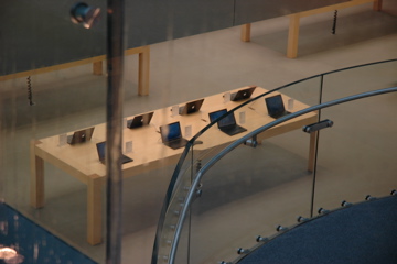 Black MacBooks on display